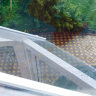 Крыша из поликарбоната надежно защищает веранду от осадков
